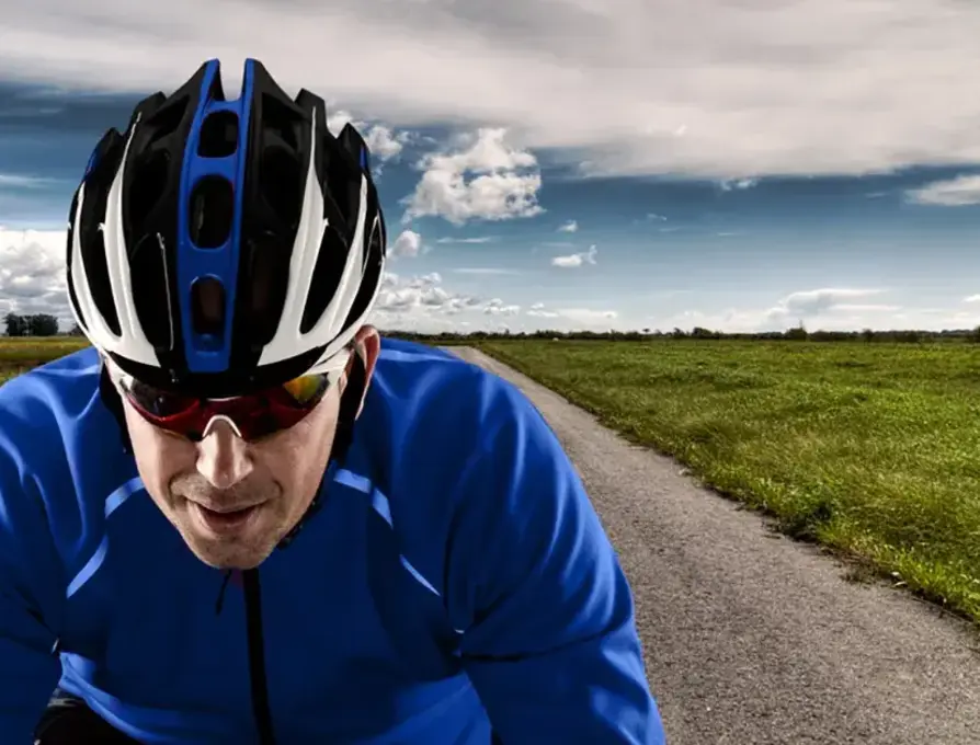 Man in blue shirt riding bicycle
