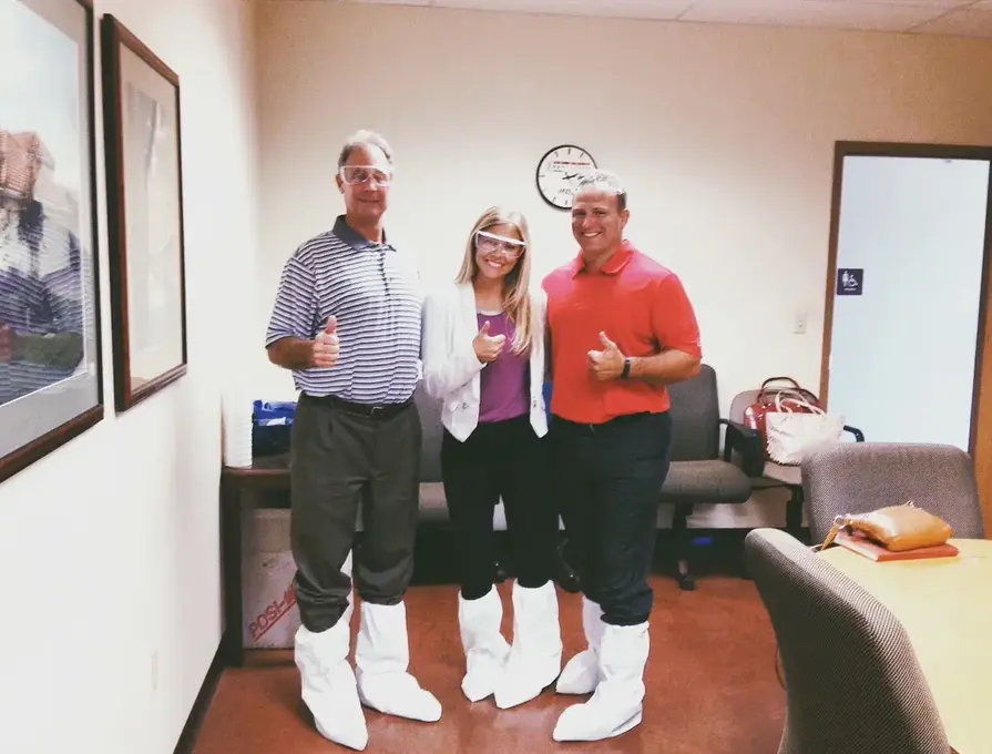 3 Palmer Holland employees in lab boots and glasses